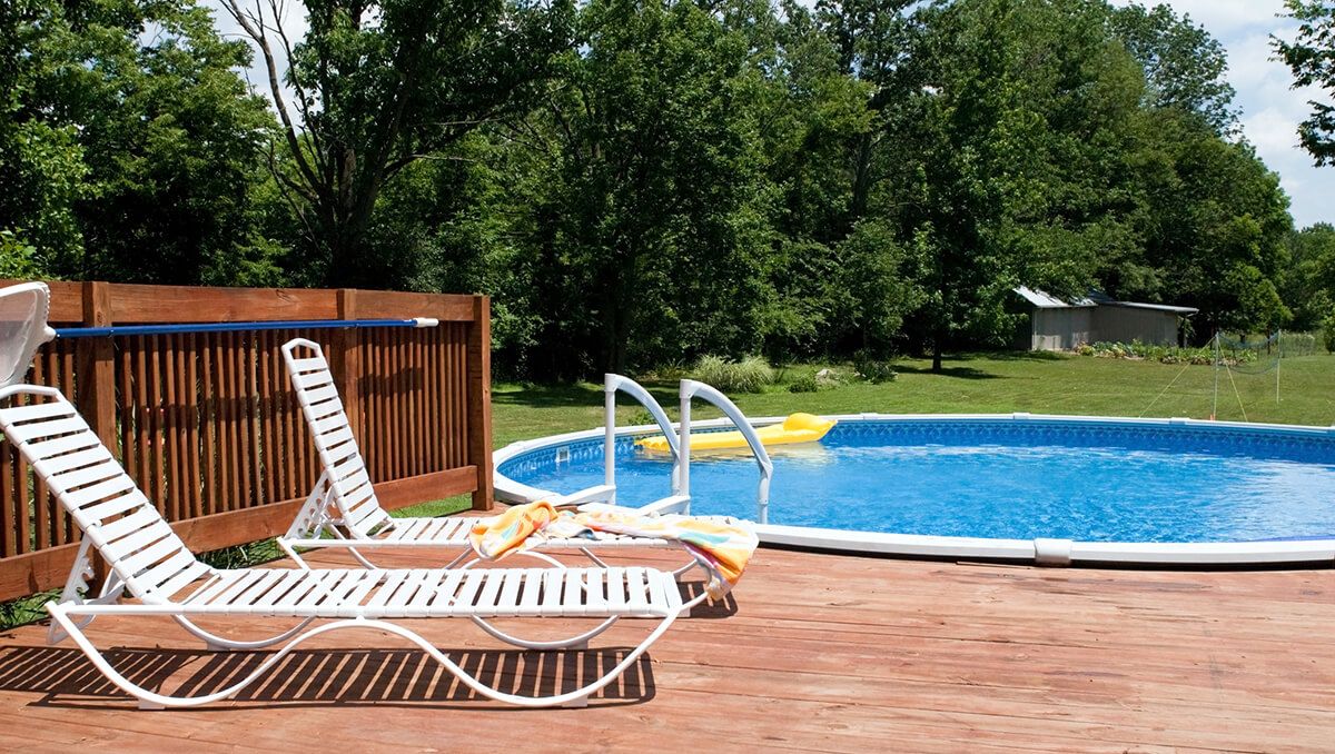 Fort Walton Beach above ground pool with deck